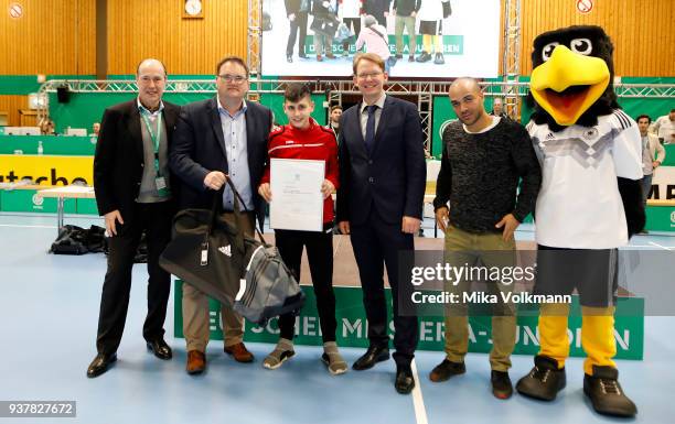 People pose as awards are handed out during the DFB Indoor Football ceremony on March 25, 2018 in Gevelsberg, Germany.