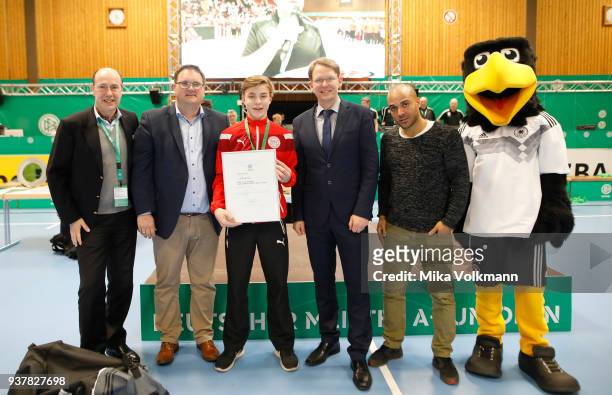 People pose as awards are handed out during the DFB Indoor Football ceremony on March 25, 2018 in Gevelsberg, Germany.