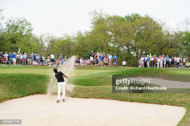 Bubba Watson of the United States plays a shot from a bunker on the 16th hole during his semifinal round match against Justin Thomas of the United...