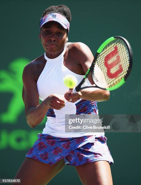 Venus Williams of the United States plays a backhand against Kiki Bertens of Belgium in their third round match during the Miami Open Presented by...