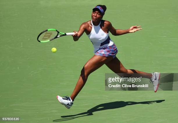Venus Williams of the United States plays a forehand against Kiki Bertens of Belgium in their third round match during the Miami Open Presented by...