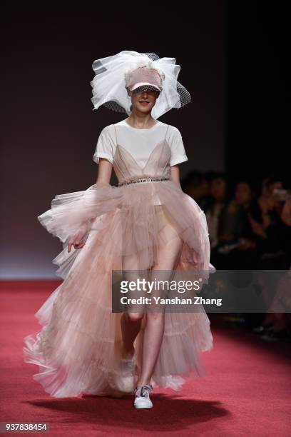 Model showcases designs on the runway at LANYU Haute Couture show during Mercedes-Benz China Fashion Week Autumn/Winter 2018/2019 at Beijing Hotel on...