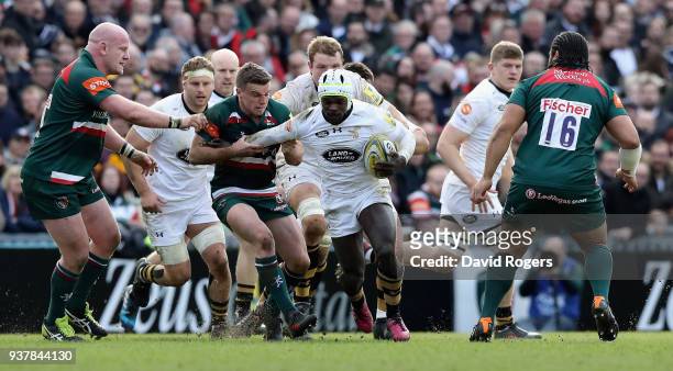 Christian Wade of Wasps is held by George Ford during the Aviva Premiership match between Leicester Tigers and Wasps at Welford Road on March 25,...