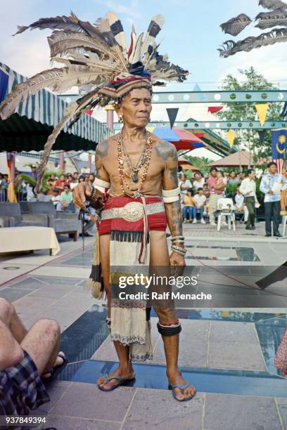 the nineties. great chief at the gawai dayak festival. kuching, sarawak malaysia. - kuching stock pictures, royalty-free photos & images