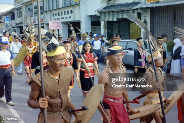 the nineties. parade of the gawai dayak festival. kuching, sarawak malaysia. - gawai dayak stock pictures, royalty-free photos & images