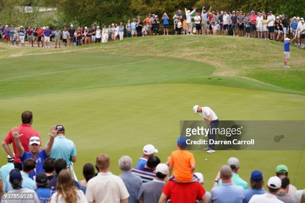 Alexander Noren of Sweden lines up a putts on the 16th green during a playoff for his semifinal round match against Kevin Kisner of the United States...