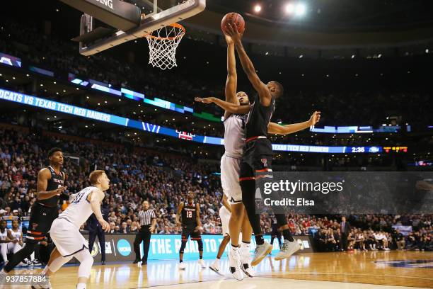 Niem Stevenson of the Texas Tech Red Raiders drives to the basket against Omari Spellman of the Villanova Wildcats during the first half in the 2018...