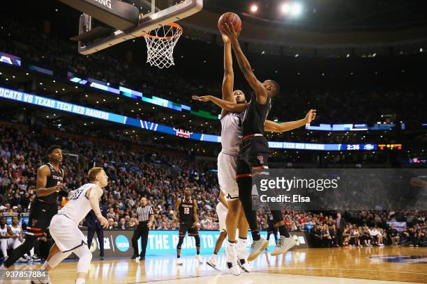 Niem Stevenson of the Texas Tech Red Raiders drives to the basket against Omari Spellman of the Villanova Wildcats during the first half in the 2018...