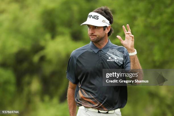 Bubba Watson of the United States reacts to his birdie on the first green during his final round match against Kevin Kisner of the United States in...