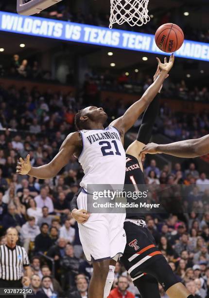 Dhamir Cosby-Roundtree of the Villanova Wildcats and Brandone Francis of the Texas Tech Red Raiders battle for the ball during the first half in the...