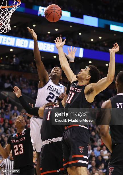 Dhamir Cosby-Roundtree of the Villanova Wildcats battles for the ball with Brandone Francis and Zach Smith of the Texas Tech Red Raiders during the...