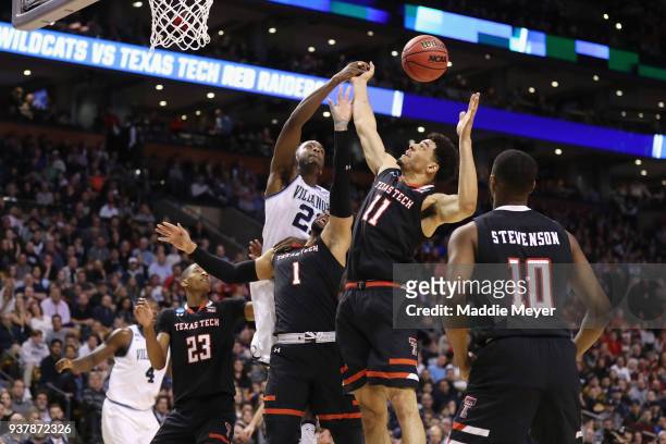 Dhamir Cosby-Roundtree of the Villanova Wildcats battles for the ball with Brandone Francis and Zach Smith of the Texas Tech Red Raiders during the...