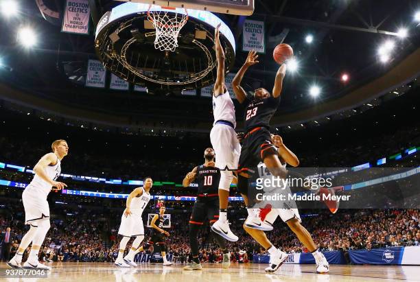 Jarrett Culver of the Texas Tech Red Raiders drives to the basket against Mikal Bridges of the Villanova Wildcats during the first half in the 2018...