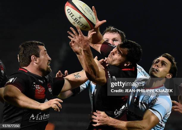 Lyon's French hooker Mickael Ivaldi and Lyon's French fly-half Lionel Beauxis vies with Racing 92's Argentinian winger Juan Imhoff during the French...