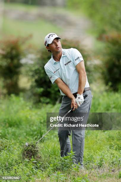 Kevin Kisner of the United States plays his second shot on the fifth hole during his final round match against Bubba Watson of the United States in...