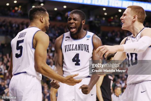 Eric Paschall celebrates with Phil Booth and Donte DiVincenzo of the Villanova Wildcats during the second half against the Texas Tech Red Raiders in...