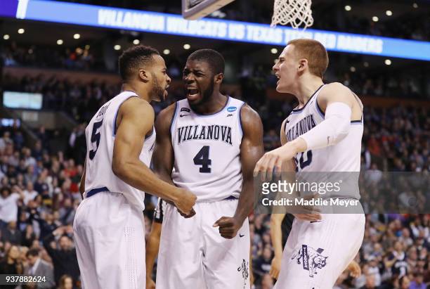 Eric Paschall celebrates with Phil Booth and Donte DiVincenzo of the Villanova Wildcats during the second half against the Texas Tech Red Raiders in...