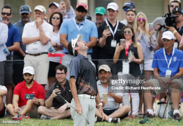 Bubba Watson of the United States reacts to his chip on the fifth hole during his final round match against Kevin Kisner of the United States in the...