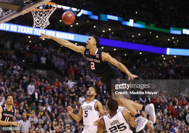 Zhaire Smith of the Texas Tech Red Raiders is unable to dunk the ball against Mikal Bridges of the Villanova Wildcats during the second half in the...