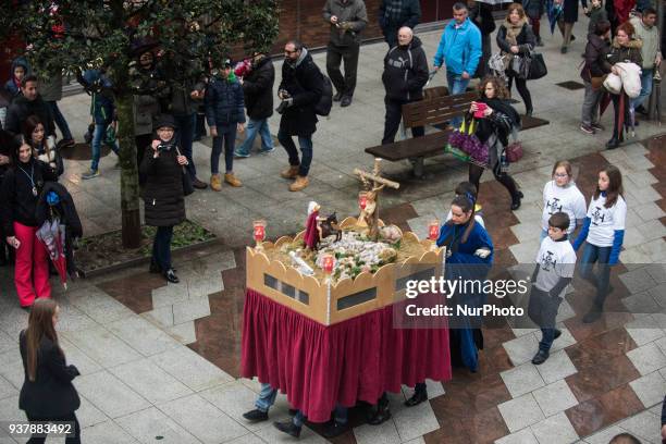 The passage is carried on the shoulders of six children during the children's procession on Palm Sunday during Holy Week in Santanderin Santander, on...