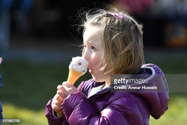 Mia Tindall enjoys an ice cream during the Gatcombe Horse Trials on March 25, 2018 in Stroud, England.