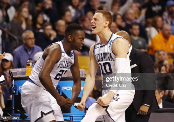 Donte DiVincenzo and Dhamir Cosby-Roundtree of the Villanova Wildcats celebrate against the Texas Tech Red Raiders during the second half in the 2018...