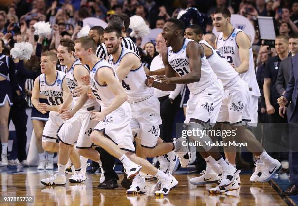 The Villanova Wildcats celebrate defeating the Texas Tech Red Raiders 71-59 in the 2018 NCAA Men's Basketball Tournament East Regional to advance to...
