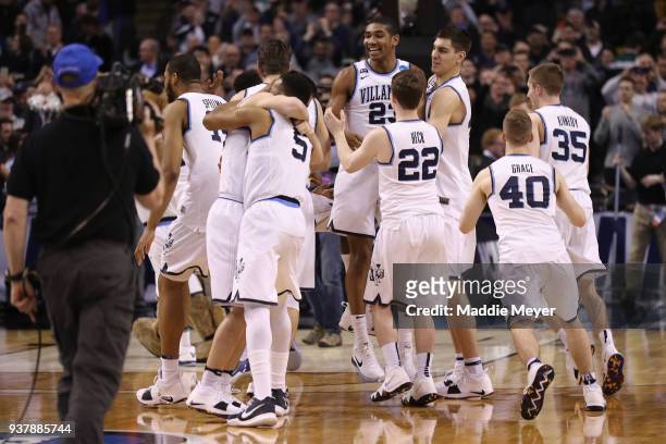 The Villanova Wildcats celebrate defeating the Texas Tech Red Raiders 71-59 in the 2018 NCAA Men's Basketball Tournament East Regional to advance to...