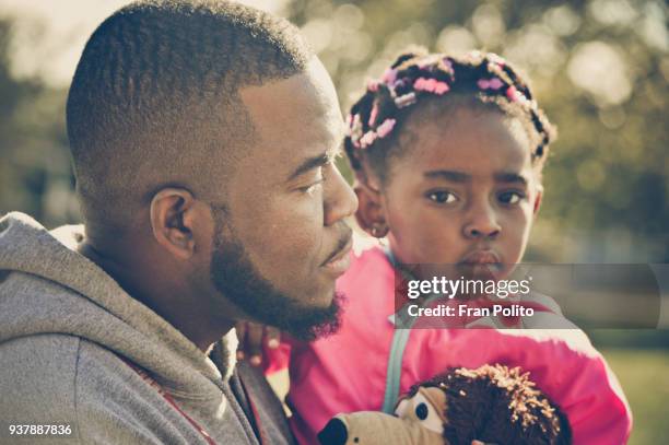 father and daughter. - cornrow braids stock-fotos und bilder