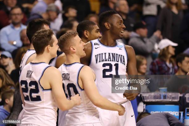 Peyton Heck, Denny Grace and Dhamir Cosby-Roundtree of the Villanova Wildcats celebrate late in the game in their teams win over the Texas Tech Red...