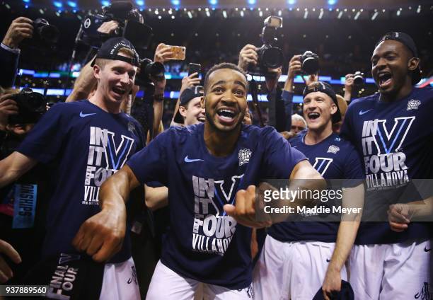 Phil Booth of the Villanova Wildcats celebrates with teammates after defeating the Texas Tech Red Raiders 71-59 in the 2018 NCAA Men's Basketball...