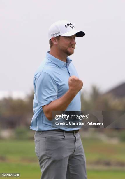 Brice Garnett reacts to his putt on the 18th green to win during the final round of the Corales Puntacana Resort & Club Championship on March 25,...