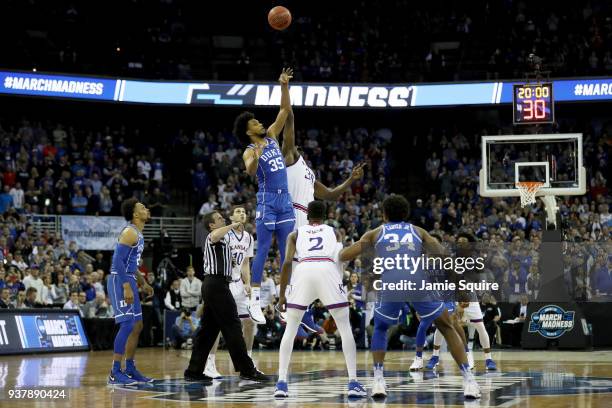 Marvin Bagley III of the Duke Blue Devils tips off against Udoka Azubuike of the Kansas Jayhawks to start the first half in the 2018 NCAA Men's...