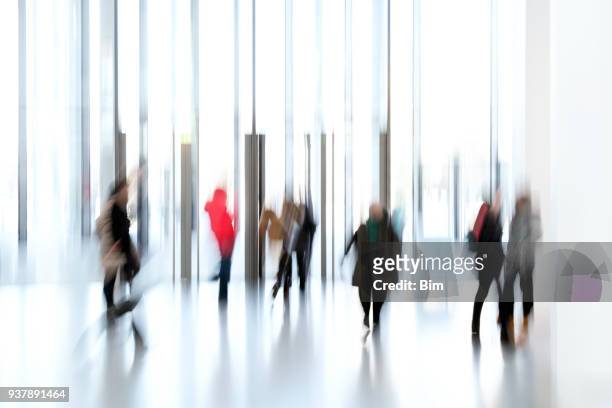 silhouettes of people in a modern interior - bokeh museum stock pictures, royalty-free photos & images