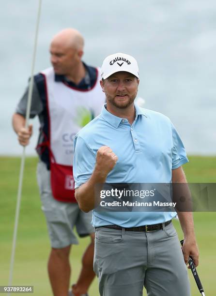 Brice Garnett reacts to his putt on the 18th green to win during the final round of the Corales Puntacana Resort & Club Championship on March 25,...