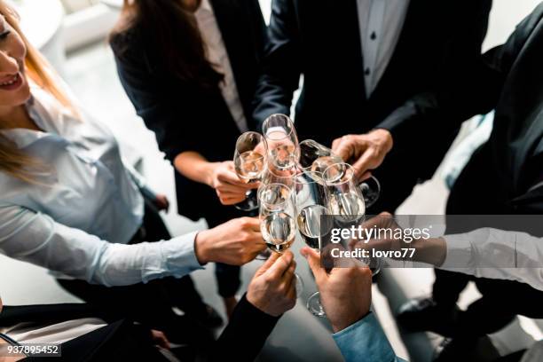 toasting to success - champagne party stock pictures, royalty-free photos & images