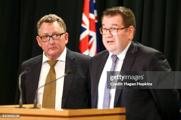 Finance Minister Grant Robertson speaks while incoming Reserve Bank Governor Adrian Orr looks on during a press conference at Parliament on March 26,...