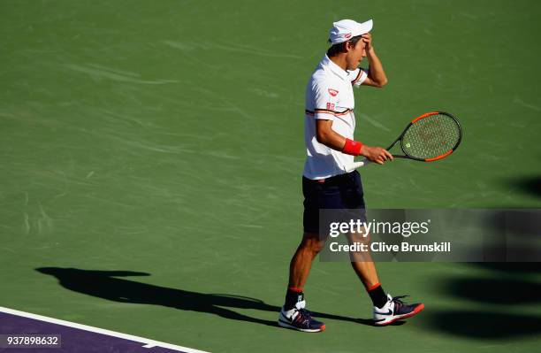 Kei Nishikori of Japan shows his frustration against Juan Martin Del Potro of Argentina in their third round match during the Miami Open Presented by...