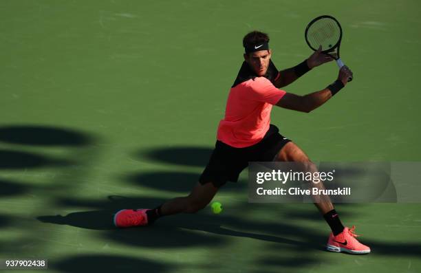 Juan Martin Del Potro of Argentina plays a backhand against Kei Nishikori of Japan in their third round match during the Miami Open Presented by Itau...