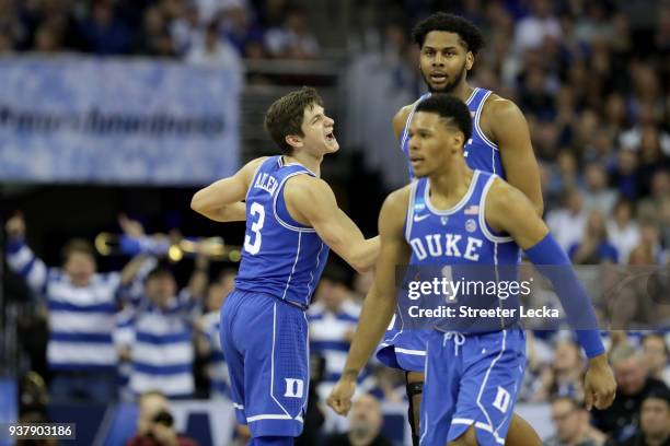 Grayson Allen of the Duke Blue Devils celebrates a basket with Marques Bolden and Trevon Duval against the Kansas Jayhawks during the first half in...