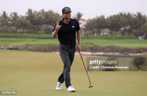 Tyler McCumber reacts to his putt on the 18th green during the final round of the Corales Puntacana Resort & Club Championship on March 25, 2018 in...
