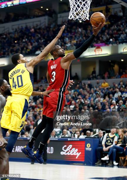 Dwyane Wade of the Miami Heat shoots the ball against the Indiana Pacers during the game at Bankers Life Fieldhouse on March 25, 2018 in...