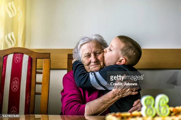 birthday - embracing grandma stock pictures, royalty-free photos & images