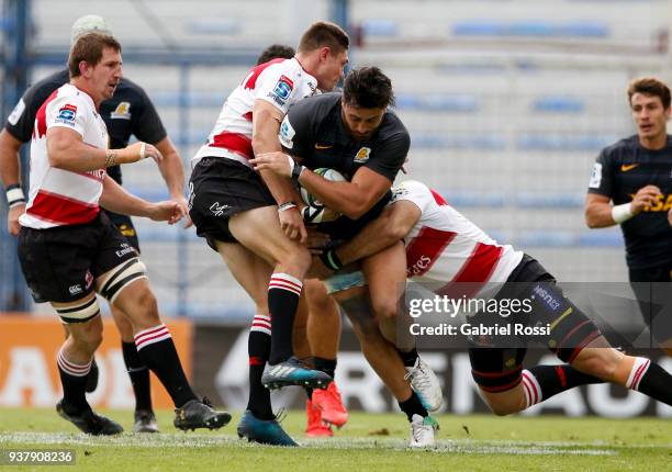 Javier Ortega Desio of Jaguares is tackled by Robert Kruger of Lions during a match between Jaguares and Lions as part of the sixth round of Super...