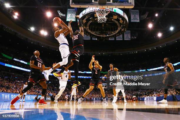 Mikal Bridges of the Villanova Wildcats shoots the ball against Norense Odiase of the Texas Tech Red Raiders during the second half in the 2018 NCAA...