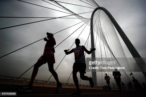 Participants run across the Margaret Hunt Hill Bridge during the Toyota Rock 'N' Roll Dallas Half Marathon on March 25, 2018 in Dallas, Texas.