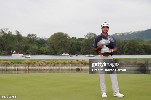 Bubba Watson of the United States celebrates with the Walter Hagen Cup after defeating Kevin Kisner of the United States 7&6 to win the World Golf...