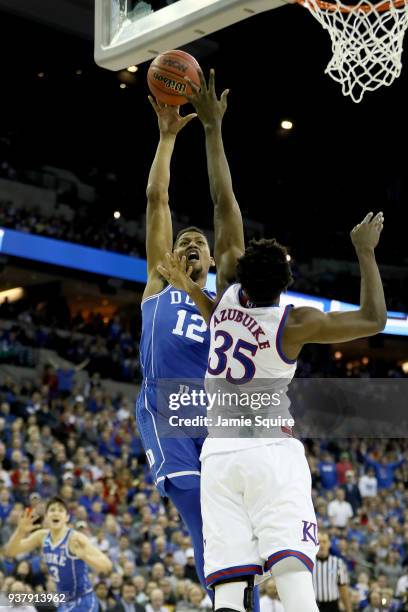 Javin DeLaurier of the Duke Blue Devils shoots the ball against Udoka Azubuike of the Kansas Jayhawks during the second half in the 2018 NCAA Men's...