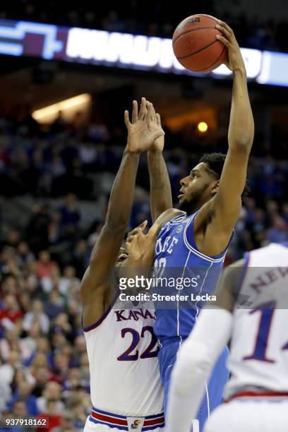 Marques Bolden of the Duke Blue Devils shoots the ball over Silvio De Sousa of the Kansas Jayhawks during the first half in the 2018 NCAA Men's...