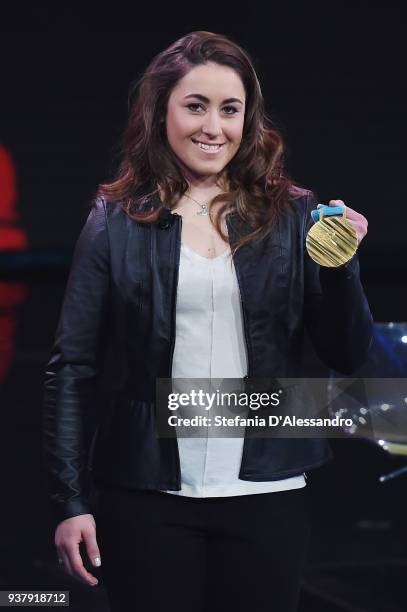Sofia Goggia poses with the gold medal during 'Che Tempo Che Fa' Tv Show on March 25, 2018 in Milan, Italy.